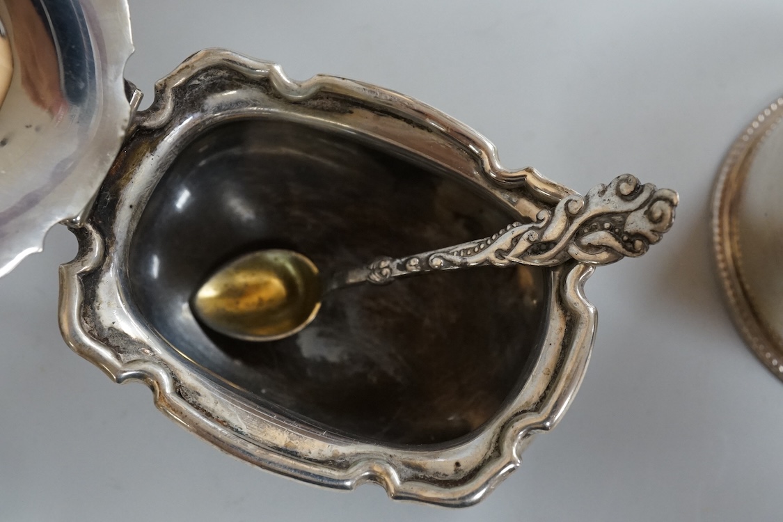 A pair of George III pierced silver shaped oval salts by Hester Bateman, London, 1783 (a.f.), with clear glass liners, together with one other George III silver oval salt, London, 1783 and two later silver mustard pots.